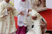 Pope Francis trips, falls, regains balance, at Mass in Poland